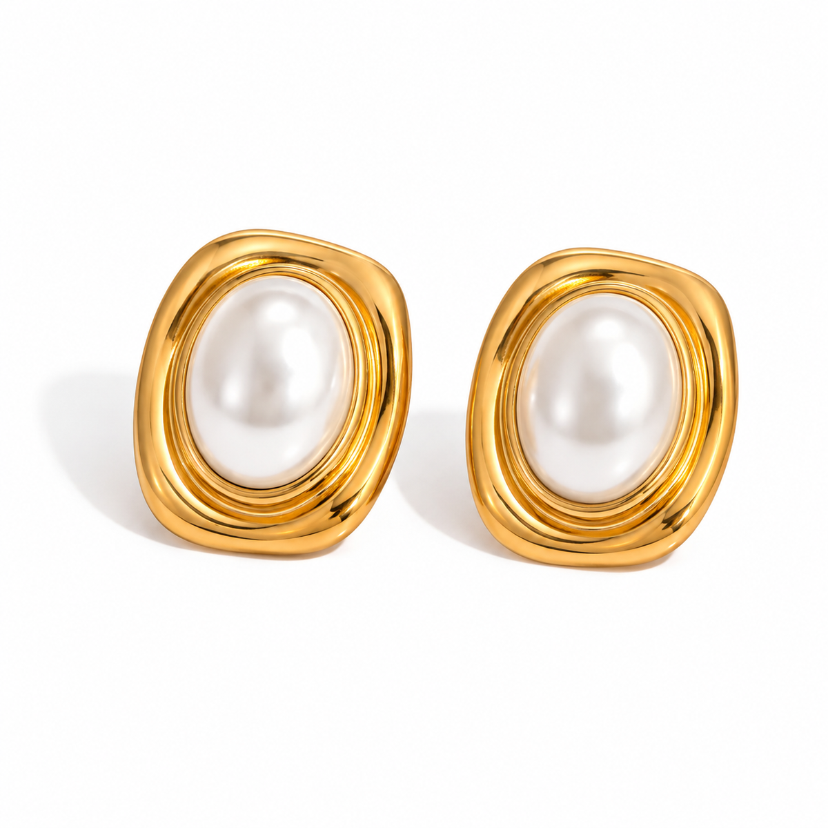 18K gold plated stainless steel stud earrings featuring oval faux pearls in an organic sculptural setting.